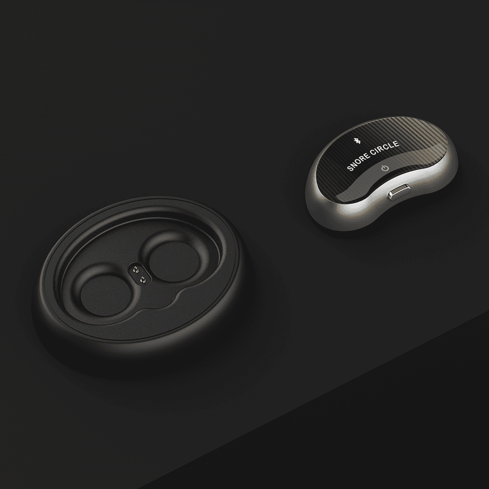 Snore Circle sensor resting by its charging case