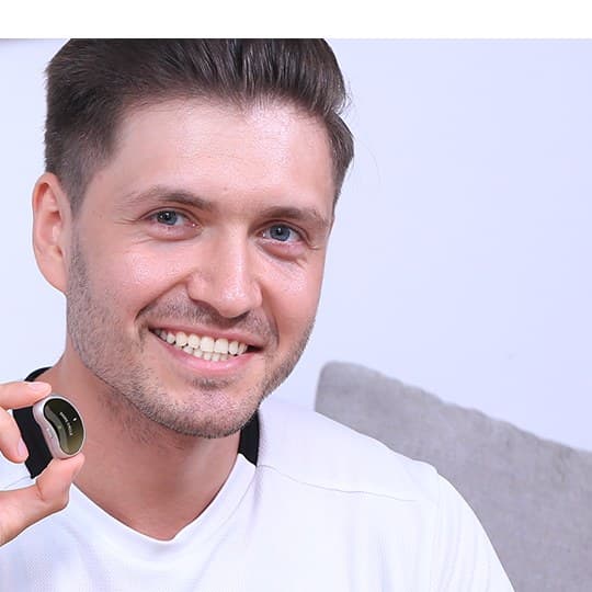 The Snore Circle sensor held between two fingers